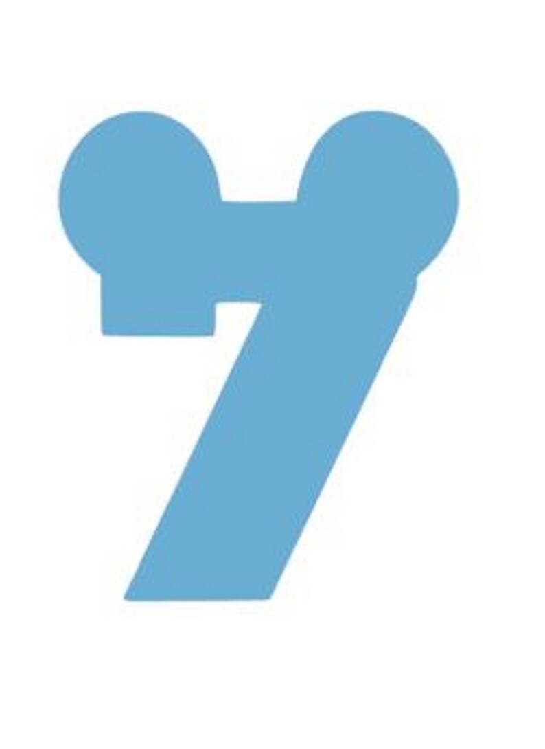 May include: A light blue number seven with rounded edges. The number has two small circles at the top.
