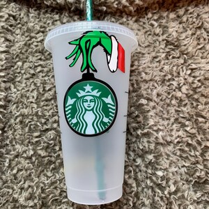 Merry Grinchmas Starbucks cup with grinch face