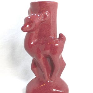 May include: A set of three ceramic mugs with a speckled, matte finish. The mugs are in shades of cream, light gray, and dark gray. Each mug has a simple, minimalist design and a rounded handle.