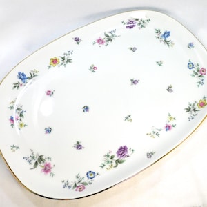 May include: A set of three ceramic mugs with a speckled, matte finish. The mugs are in shades of cream, light gray, and dark gray. Each mug has a simple, minimalist design, perfect for coffee or tea.