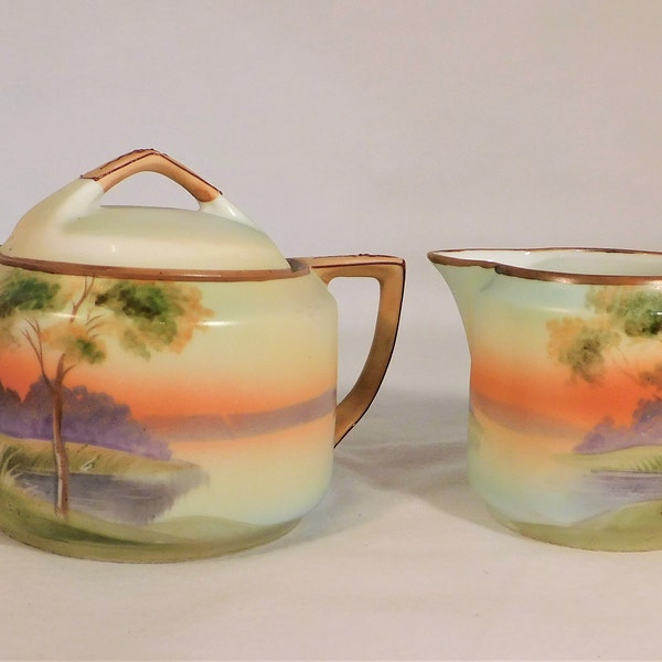 Nippon Porcelain Creamer & Sugar Set with Lid Hand Painted Small 3" Tall Multicolor Tree Lake Scene Brown Edge Antique Tableware
