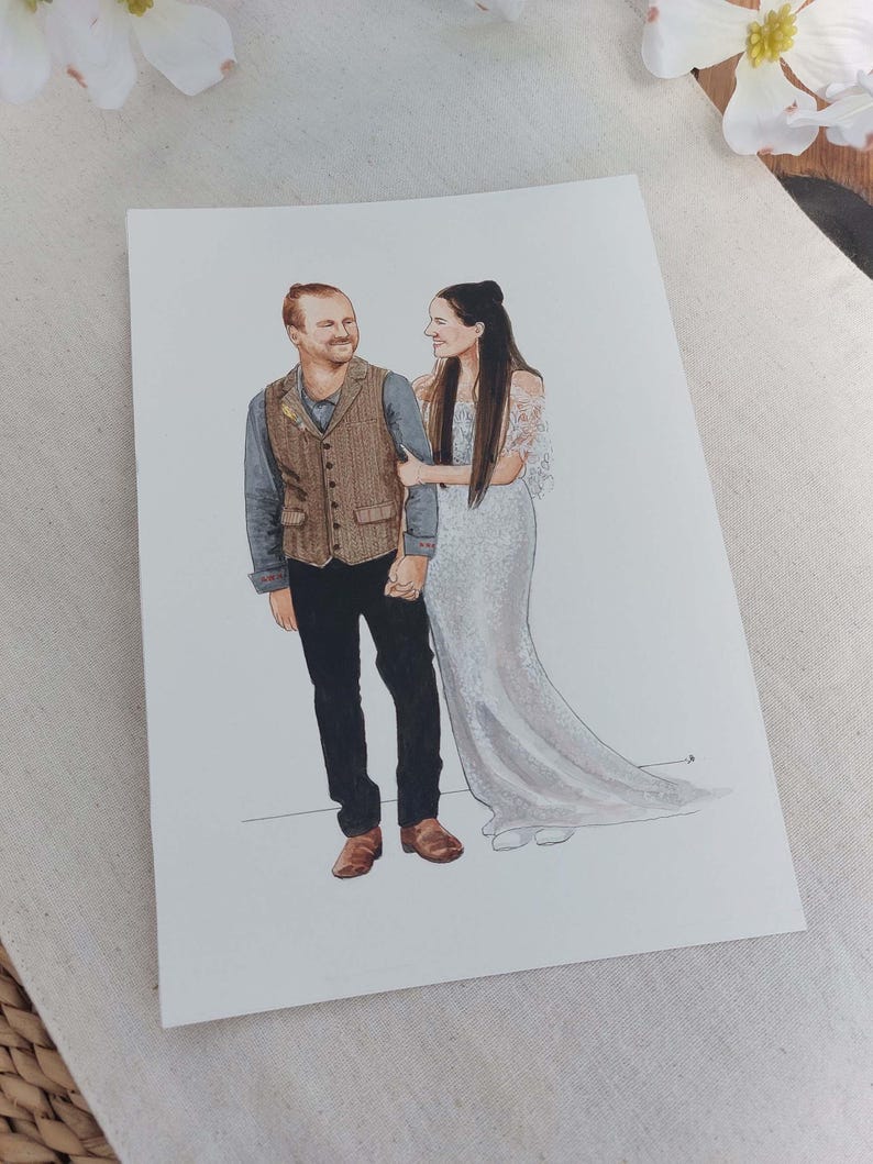 May include: A watercolor painting of a couple in wedding attire. The man is wearing a brown vest over a blue shirt and black pants. The woman is wearing a white dress with a lace bodice. The couple is standing side by side, smiling at each other.