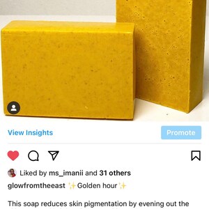 May include: Two bars of yellow soap, one on top of the other. The soap is described as reducing skin pigmentation, evening out skin tone, and brightening skin. It contains antibacterial properties, Vitamin E, and helps reduce acne and pimples. The soap is also said to moisturize and revitalize skin cells. The soap is described as reducing scarring and rejuvenating dull looking skin. The caption includes the text "Golden hour" and "glowfromtheeast".