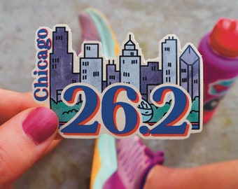 May include: A colourful sticker with a cityscape design and the text "Chicago 26.2".