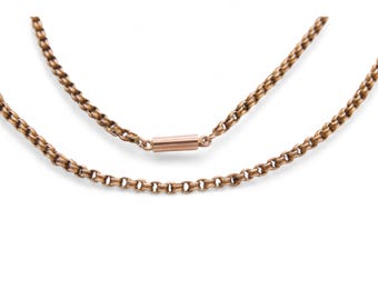 May include: Two antique gold necklaces. The top necklace has a bar clasp, and the bottom necklace has a chain link design. Both necklaces are a warm gold color and are displayed against a white background.