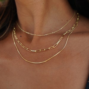 Wedding gold layered necklace set. Perfect for bridesmaid and bridal jewelry. Special occasion jewelry and necklace. Necklace is adjustable and comes with lobster clasps.  14K gold dainty chains triple strand. Each chain link varies in size.