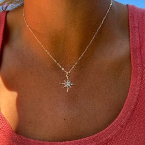 Here is an example of the gold North Star chain worn on its own. Each chain comes separately. This pendant is on a thin and dainty 14k cable chain. Perfect for additional layering and stacking.