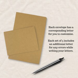 May include: Two brown envelopes stacked on top of each other on a white fabric surface. A silver pen is lying on the surface. The text on the image reads: "Each envelope has a corresponding letter for you to customize. Each set of 5 includes an additional letter for any errors while writing your letters."
