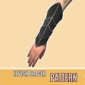 May include: Black Elvish bracer pattern with white stitching, worn on a person's arm. The bracer has a geometric design. The text "Elvish Bracer Pattern" is displayed on a yellow banner at the bottom of the image.