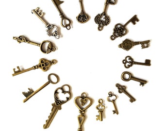 May include: A collection of 15 antique-style skeleton keys in various shapes and sizes, arranged in a circle on a white background. The keys are made of metal and have a bronze finish.