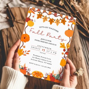 May include: A rectangular invitation card featuring a white background with a border of orange pumpkins, yellow and brown autumn leaves, and acorns. The text reads: Let's Get Together Fall Party, Join Us For Food, Friends And Fun, September Friday 15 at 6 PM 2026, Pumpkin Patch Lane, 127 Maple Grove Lane, Autumn Hills, VT 05001, RSVP to Julia: +123-456-7890.