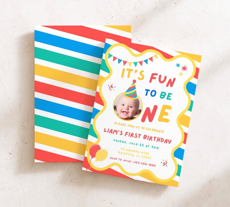 May include: A birthday invitation card featuring a colorful diagonal striped pattern in red, yellow, blue, and teal. The card displays the text IT'S FUN TO BE ONE, a photo of a baby wearing a party hat, and event details for Liam's first birthday.