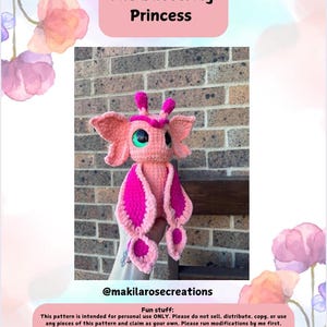 May include: A pink and fuchsia crocheted butterfly plush toy with green eyes. The toy is called "Ms. Vicorie The Butterfly Princess" and is a crochet pattern by @makilarosecreations.