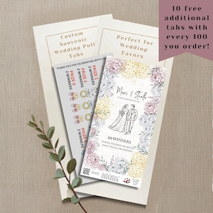 以下が含まれることがあります： 花柄の縁取り、カップルの線画、Mari & Stella、10 Winners、During Wedding Reception Pack Chance Promotion、08082026のテキストが印刷されたカスタムウェディングプルタブ。賞品カテゴリーとアイコンが記載されたグレーのシートが含まれています。