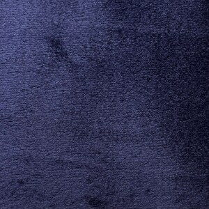 May include: A close-up of a dark blue fabric with a textured surface.