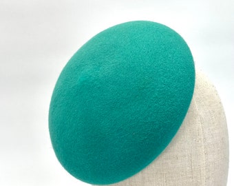 Base de fascinateur en forme de bouton vert 18 cm