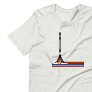 L es para la camiseta de Launch America