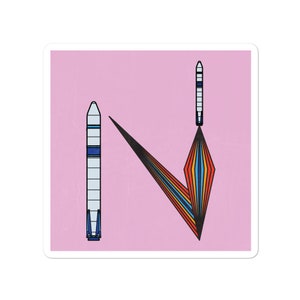 May include: A pink background with two rockets, one on the left and one on the right. The rocket on the right is launching and has a rainbow-colored flame. The rocket on the left is standing upright.