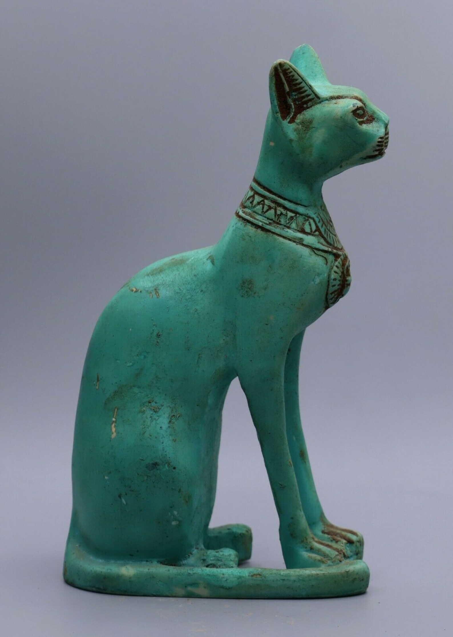 green cat statue