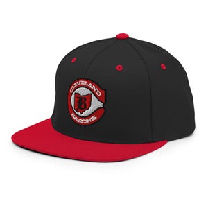 May include: Black and red baseball cap with an embroidered Cleveland Barons logo featuring a white 'B' inside a red outline of the state of Ohio.