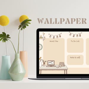 May include: A laptop displays a beige desktop wallpaper with sections labeled "Work Files," "To Do List," and "Note to self." The word "WALLPAPER" is above the screen. Vases with yellow and green floral arrangements are in the foreground.