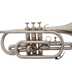 May include: A silver-colored cornet with three valves and a bell. The cornet is a brass instrument used in marching bands and orchestras.