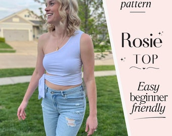 May include: A woman wearing a white one-shoulder top tied at the waist, blue jeans, and a gold necklace. The image is a digital sewing pattern for a top called "Rosie" and includes a free linen dress pattern. The text "Digital sewing pattern" and "Easy beginner friendly" is also included in the image.