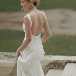 backless peplum dress Momyknows Chic White Halter Neck Backless Ribbons Peplum Falbala Photoshoot  Vacation Maternity Mini Dress