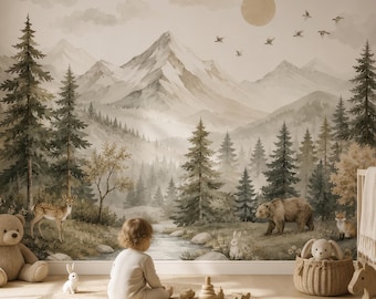 May include: A wall mural featuring a watercolor landscape of snow-capped mountains, a dense pine forest, and a flowing stream. The scene includes illustrations of a deer, a bear, and a fox. The mural is displayed in a room with a crib and toys.