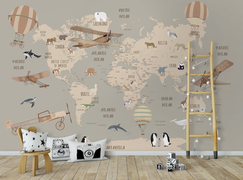 May include: A light brown world map with illustrations of animals, hot air balloons, and airplanes. The map is on a light gray wall with a wooden ladder and a wooden chair with a black and white pillow.