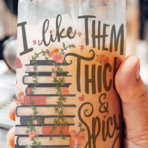 a person holding a jar with some writing on it