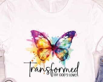 May include: White t-shirt with a colorful butterfly graphic and the text "Transformed by God's Love".