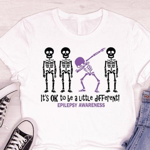 Epilepsy Support Clothing, Skeleton Graphic Tees, Purple Ribbon T-Shirt, It's Ok To Be A Little Different, Epilepsy Disease Awareness Shirt