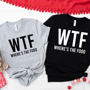 two t - shirts that say wft where's the food and where '