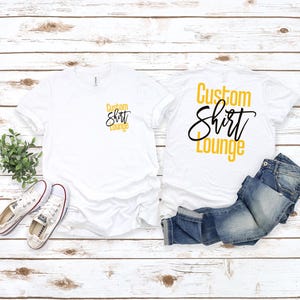 a couple of shirts sitting on top of a wooden floor