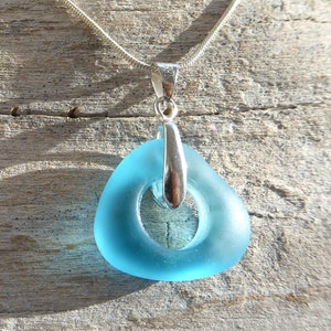 round pendant with turquoise sea glass and silver-colored loop