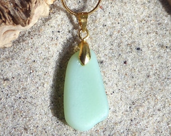 Sea glass pendant in mint green with a gold-colored loop