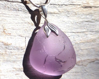 Pendant made of sea glass in pastel violet and 925 silver loop in the shape of a leaf