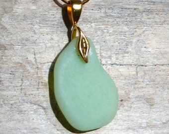 Sea glass pendant in mint green (opaque) with golden loop in leaf shape