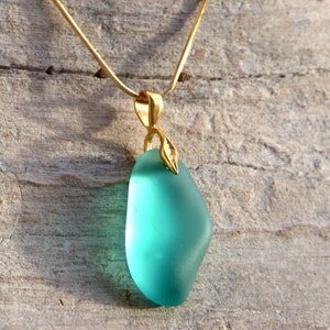 Sea glass pendant in green turquoise with golden leaf loop