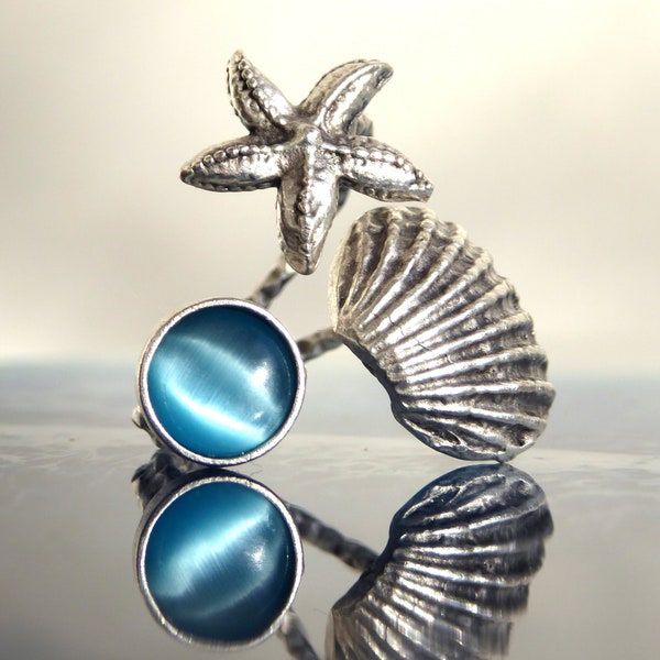 Ring mit Muschel, Seestern und hellblauem Glas , silberfarbend