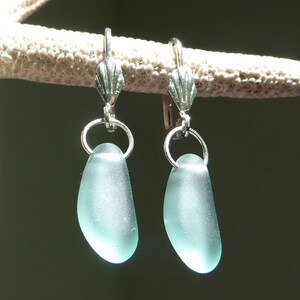 Earrings with light turquoise sea glass and silver shell leverbacks