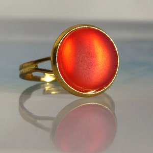 Ring with red-orange sea glass, gold-coloured
