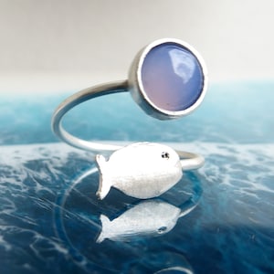 Wrap ring with blue-violet glass cabochon and silver-colored fish