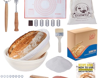 May include: A sourdough bread baking set with a white proofing basket, a linen bread bag, a dough scraper, a scoring tool, a pastry brush, a silicone baking mat, a recipe book, and a set of dough cutters.