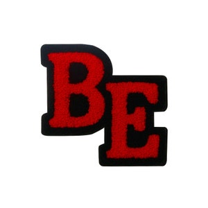 May include: Red felt letters "BE" with black outlines. The letters are sewn together and have a fuzzy texture.