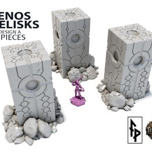 May include: Three gray Xenos Obelisks, Design A, are displayed with a small purple figurine and rocks. The obelisks are rectangular with circular and linear design elements. The image includes the text "Xenos Obelisks DESIGN A 3 PIECES".