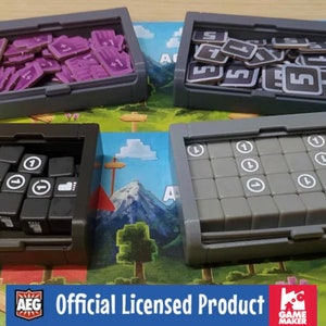 May include: Four gray plastic storage boxes with lids, each containing different game pieces. The boxes are labeled "Adventure" and "Draw". The boxes contain purple and brown tiles, black dice, and gray cubes.