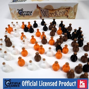 May include: A collection of 50 small, round, 3D printed potion bottles in white, orange, brown, and black. The bottles are arranged in rows on a white surface. The bottles are labeled "WordCraft" and are an official licensed product.