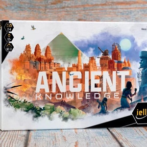 May include: A board game box with a white background and a colorful illustration of ancient buildings and structures. The title of the game is "ANCIENT KNOWLEDGE" in white letters. The game is for 2-4 players, ages 12+, and takes 30-60 minutes to play. The box is from the publisher iello.